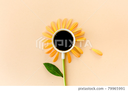Cup of coffee and flower petals on a beige background. Flat lay, top view Cup of coffee and flower petals on a beige background. Flat lay, top view 79965991