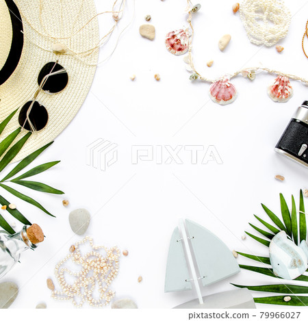 Traveler accessories, tropical palm leaf branches on white background. Travel vacation concept. Summer background. Road frame set. Flat lay, top view. 79966027