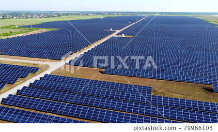 Aerial drone view flight over solar power station panels. Aerial drone view flight over solar power station panels. 79966103