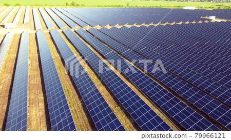 Aerial drone view flight over solar power station panels. Aerial drone view flight over solar power station panels. 79966121