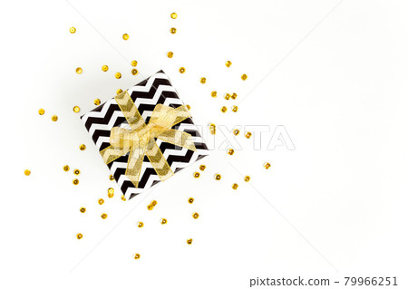 Gift or present box and stars confetti on a white background. Colorful celebration, birthday. Christmas or New Year pattern. Flat lay, top view  79966251