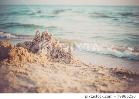 Sand castle standing on the beach. Travel vacations concept. 79966256