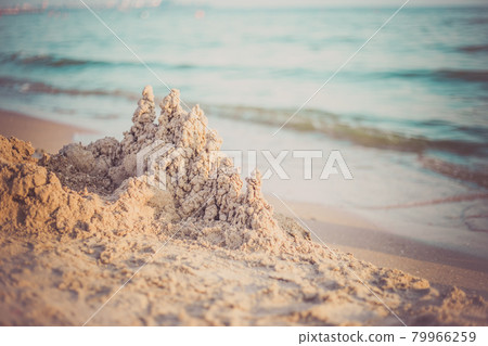Sand castle standing on the beach. Travel vacations concept. 79966259