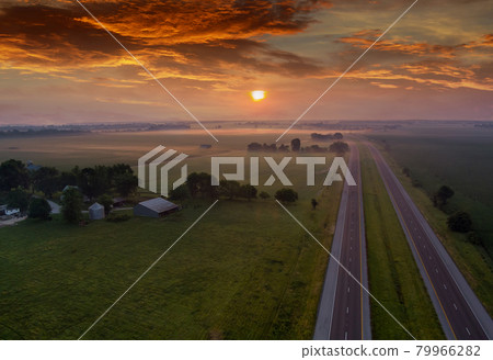 Sunrise over the meadow in the morning fog sunrise natural landscape Sunrise over the meadow in the morning fog sunrise natural landscape 79966282