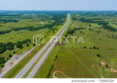 Aerial view panorama of original the historic Route 66 roadbed near Clinton Oklahoma Aerial view panorama of original the historic Route 66 roadbed near Clinton Oklahoma 79966286