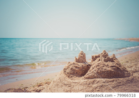 Sand castle standing on the beach. Travel vacations concept. 79966318