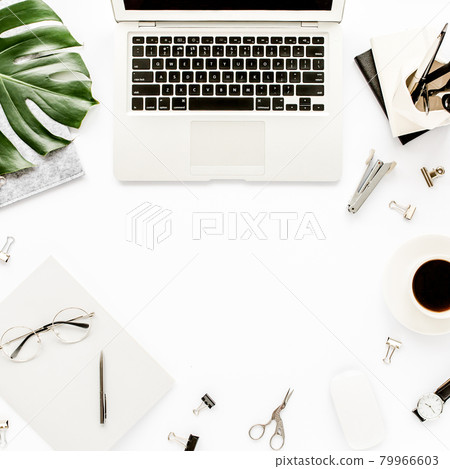 Home office workspace mockup with laptop, tropical leaves Monstera, clipboard, notebook and accessories on white background. Flat lay, top view 79966603