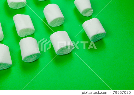 sweet marshmallow, candy on green background, top view sweet marshmallow, candy on green background, top view 79967050