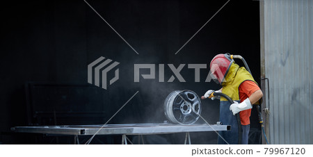 Man using sandblaster for cleaning metal details at work Man using sandblaster for cleaning metal details at work 79967120