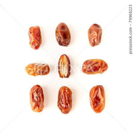 Dried dates isolated on white Dried dates isolated on white 79968223