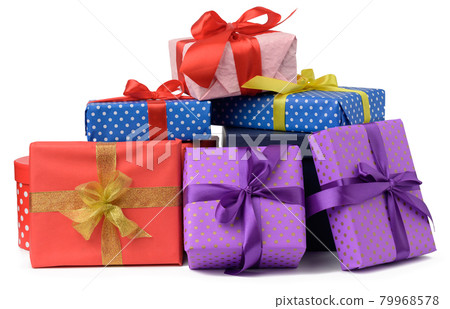 stack of boxes wrapped in paper and tied with a silk ribbon on a white background, celebration 79968578