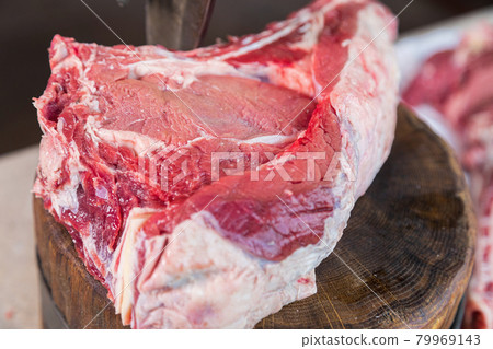 Raw meat on a deck for making lunch. Fresh meat on a cutting board. 79969143