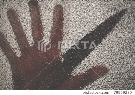 Knife in hand. Aggressive tin attack. Hacking attempt. The criminal behind the glass 79969280