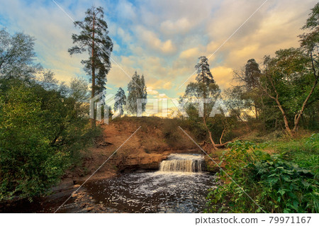 Beautiful summer landscape with a waterfall Beautiful summer landscape with a waterfall 79971167