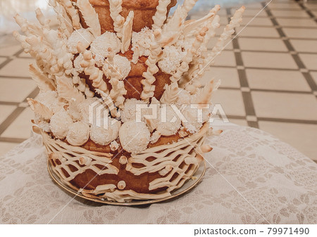 Wedding pastries, multi-tiered decorative pie, confectionery delicacy Wedding pastries, multi-tiered decorative pie, confectionery delicacy 79971490