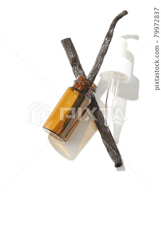 Shooting aroma bottles and vanilla beans on a white background 79972837
