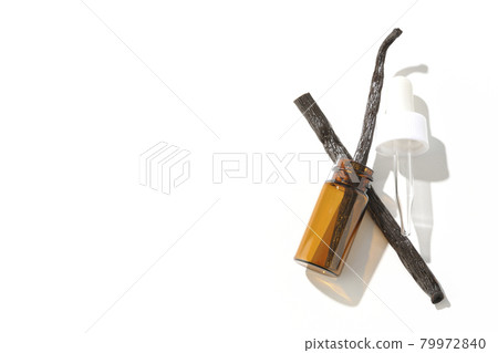 Shooting aroma bottles and vanilla beans on a white background 79972840