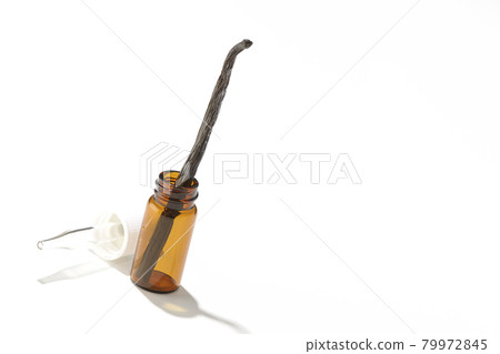 Shooting aroma bottles and vanilla beans on a white background 79972845