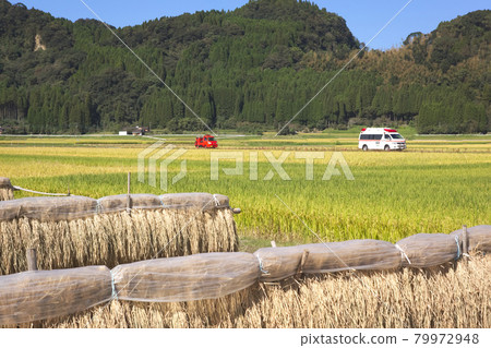 Ambulance running in the countryside 79972948