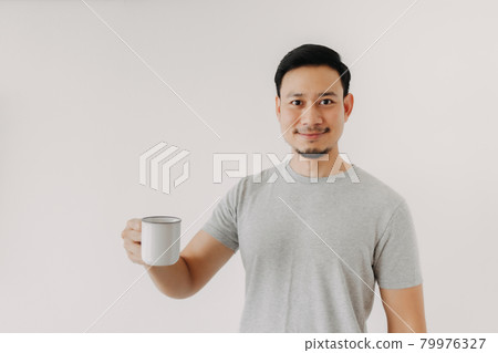 Happy man hold a cup of coffee isolated on white background. Happy man hold a cup of coffee isolated on white background. 79976327