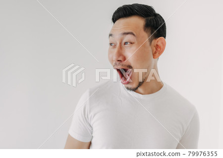 Funny shocked and surprised face of man isolated on white background. Funny shocked and surprised face of man isolated on white background. 79976355