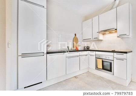 Interior of a beautiful kitchen of an elite house Interior of a beautiful kitchen of an elite house 79979783