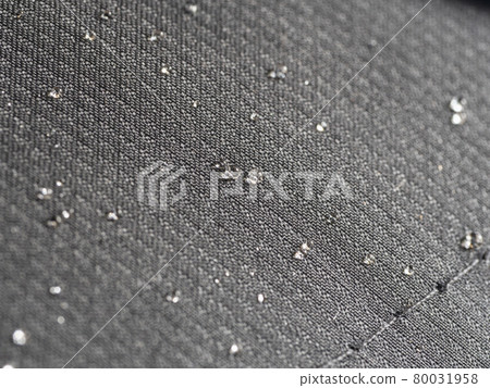 Water-repellent black fabric with water droplets. Water-repellent black fabric with water droplets. 80031958