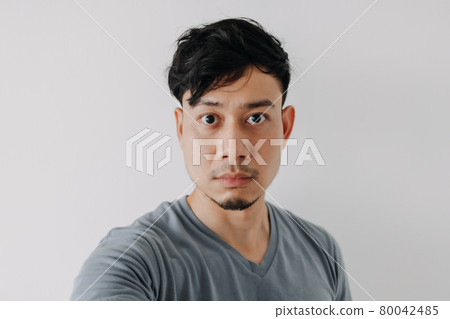 Selfie photo of man in blue t-shirt isolated on white background. 80042485