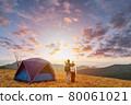 Young couple traveler looking landscape at sunset and camping on mountain, Adventure travel lifestyle concept 80061021