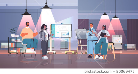 tired mix race businesspeople team analyzing statistic data on digital screen teamwork concept dark night office interior 80069475