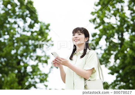 Female smartphone search outdoors 80078027