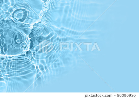 Blurred transparent blue colored clear water surface texture. Water waves in sunlight. Copy space Blurred transparent blue colored clear water surface texture. Water waves in sunlight. Copy space 80090950