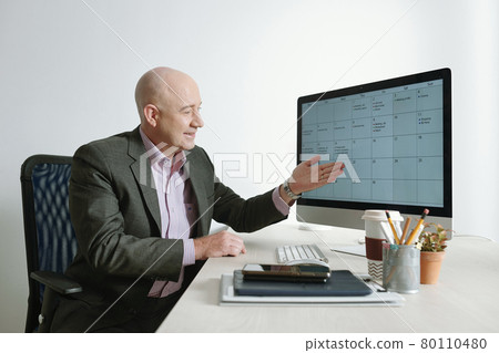 Businessman using computer at work Businessman using computer at work 80110480