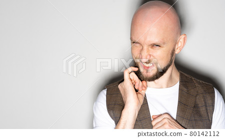 scheming man sneering face sneaky sly devious scheming man sneering face sneaky sly devious 80142112