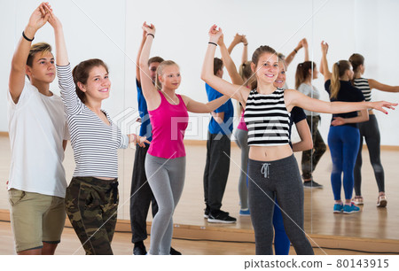 Cheerful students dancing waltz Cheerful students dancing waltz 80143915