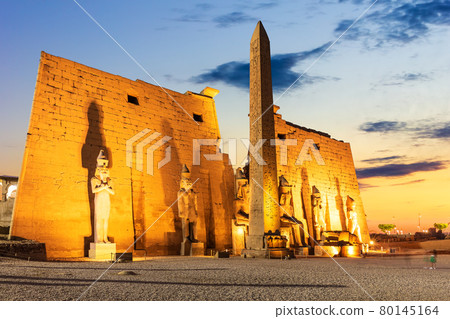 Pylon with obelisk in Luxor Temple, beautiful evening view, Egypt 80145164