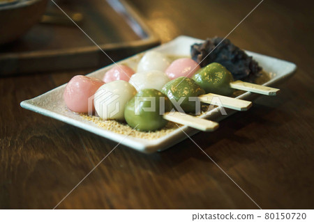 Three Color Japanese  Hanami Dango Dumpling sweet dessert on white ceramic plate. 80150720