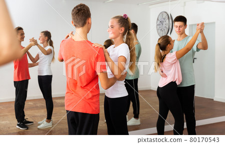 Teens in pairs learning to dance waltz Teens in pairs learning to dance waltz 80170543