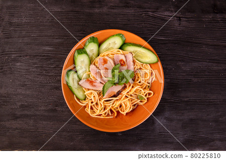 noodles with meat and fresh cucumbers with sauce 80225810