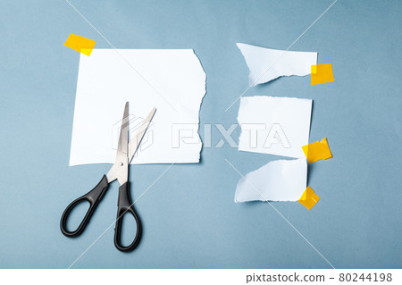Pieces of paper and adhesive tape on paper background Pieces of paper and adhesive tape on paper background 80244198