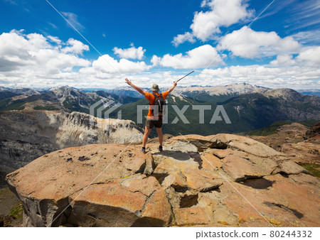 Traveler on mountain top 80244332