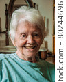 Portrait of old lady with white hair and smile 80244696