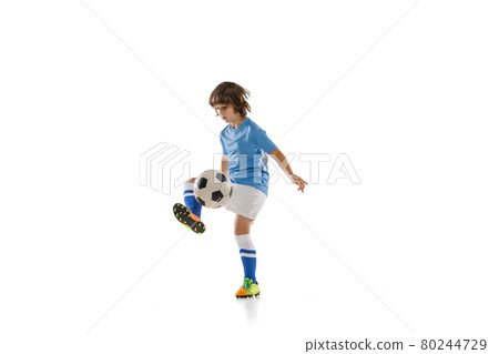 One preschool boy, football soccer player in action, motion training isolated on white studio background. Concept of sport, game, hobby 80244729