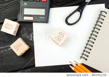 Wooden cubes with numbers on tabletop close up. Education concept Wooden cubes with numbers on tabletop close up. Education concept 80245230