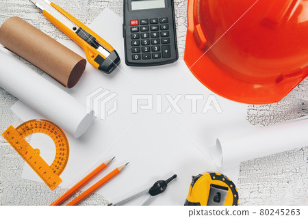safety helmet and Scrolls of engineering drawings and supplies safety helmet and Scrolls of engineering drawings and supplies 80245263