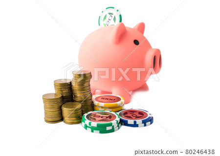 Piggy bank and money coins stack with casino chips on white background. Concept of gambling savings. 80246438