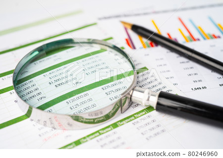 Magnifying glass on charts graphs paper. Financial development, Banking Account, Statistics, Investment Analytic research data economy, Stock exchange trading, Business office company meeting concept. Magnifying glass on charts graphs paper. Financial development, Banking Account, Statistics, Investment Analytic research data economy, Stock exchange trading, Business office company meeting concept. 80246960