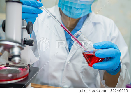 Asian scientist biochemist or microbiologist working research with a microscope in laboratory. For protect outbreak Coronavirus Covid19, bacteria and germs. Asian scientist biochemist or microbiologist working research with a microscope in laboratory. For protect outbreak Coronavirus Covid19, bacteria and germs. 80246963