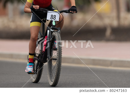 Cycling rider competing in the child class 80247163