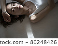 Portrait of a woman lying down 80248426